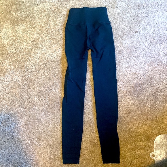 These are small form fitting black leggings by SculpKnit made by Fabletics. - Picture 2 of 3